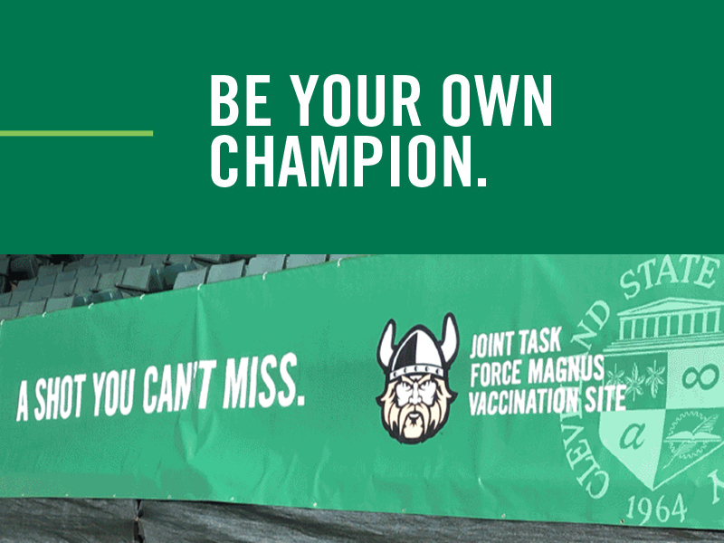 Green banner with "A Shot You Can't Miss" and cartoon Viking head. Seal of Cleveland State University (CSU). Text above reads "Be Your Own Champion." Promoting a vaccination site by Joint Task Force Magnus in Ohio. Get your first shot today!